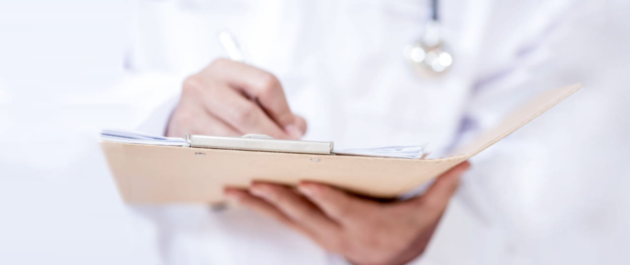 Doctor writes prescriptions